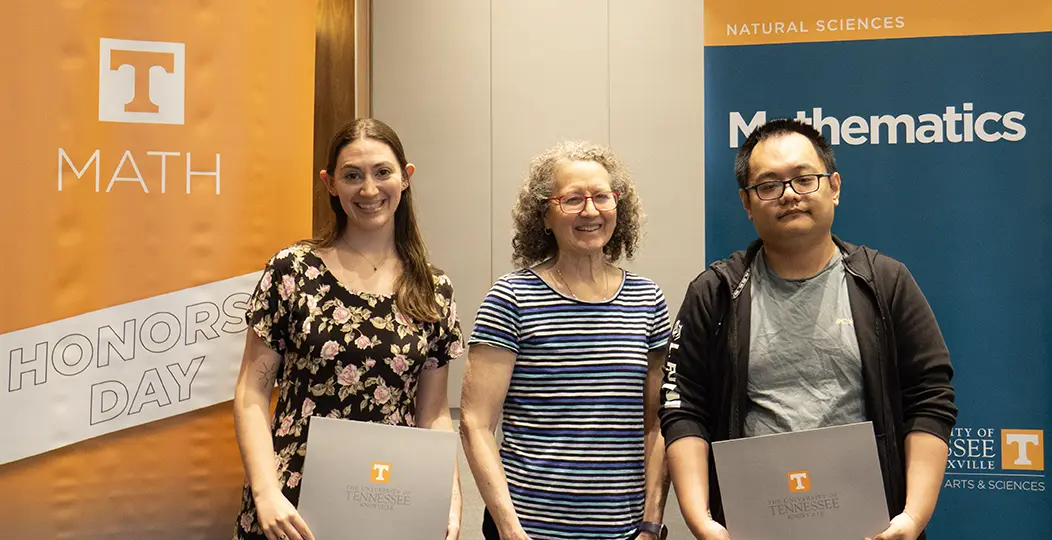 Pictured are Jeccica Kingsley, Dr. Lenhart, and Bingzhou Wang.